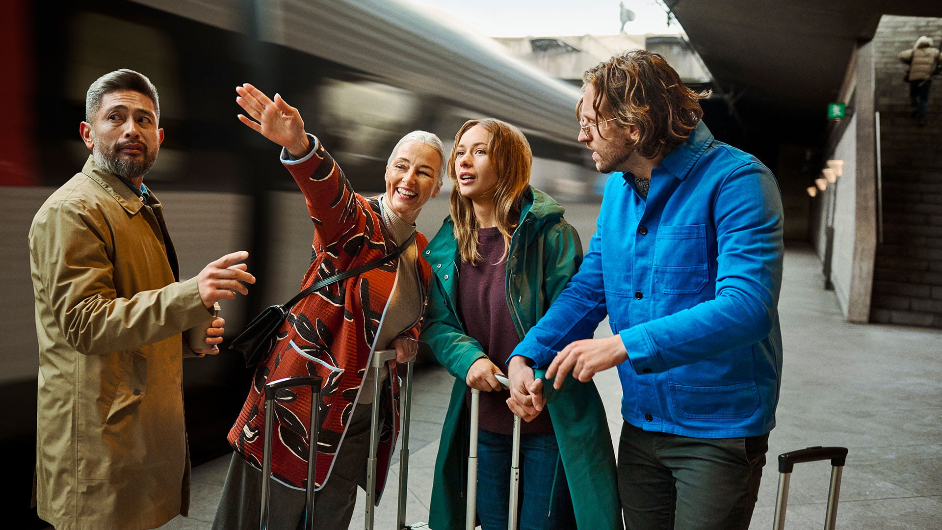 Woman showing direction on a train station